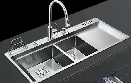 Stainless-steel multi-zone sink configuration with faucet and accessory trays